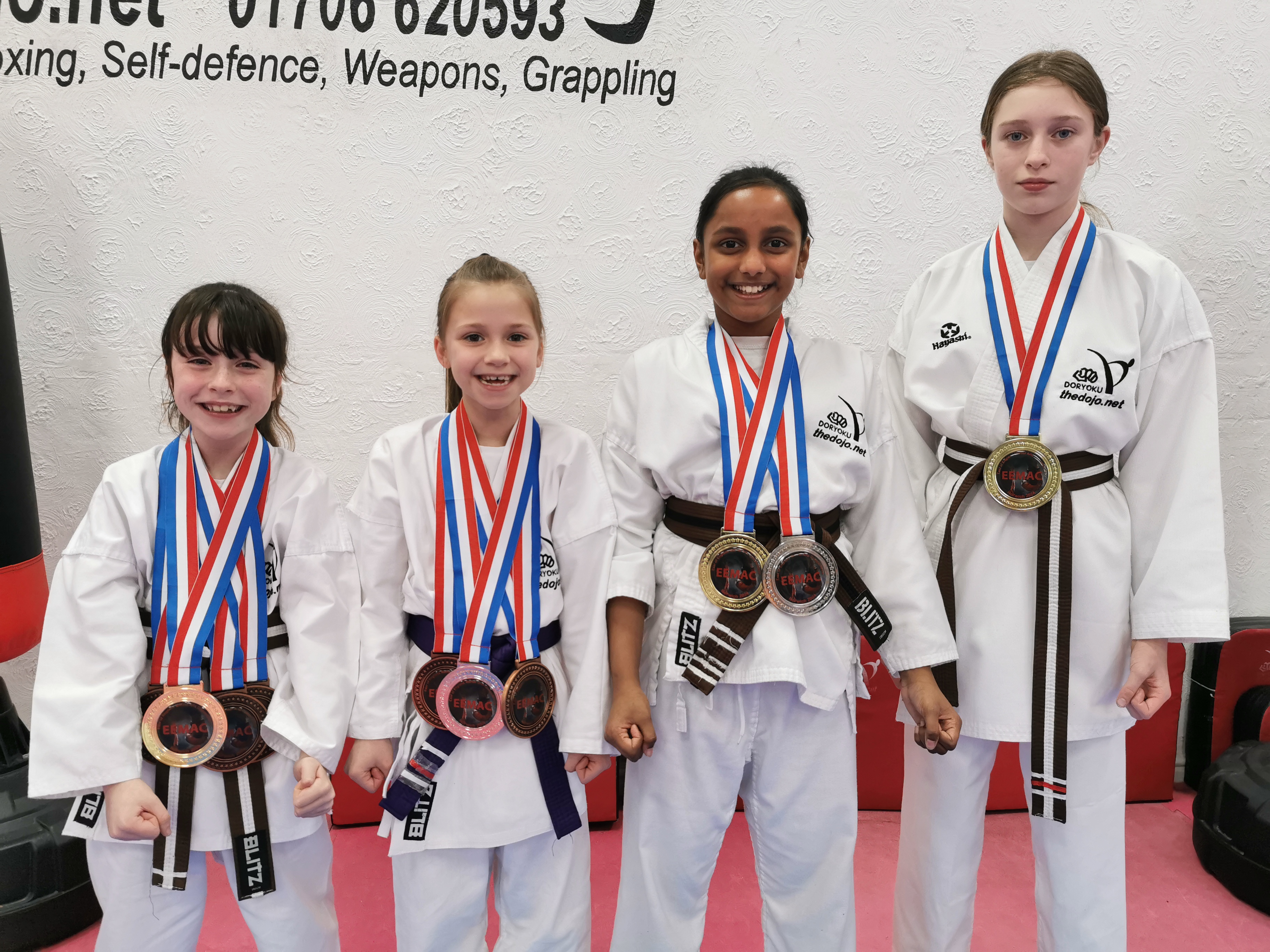 4 DOJO members return with 10 medals.